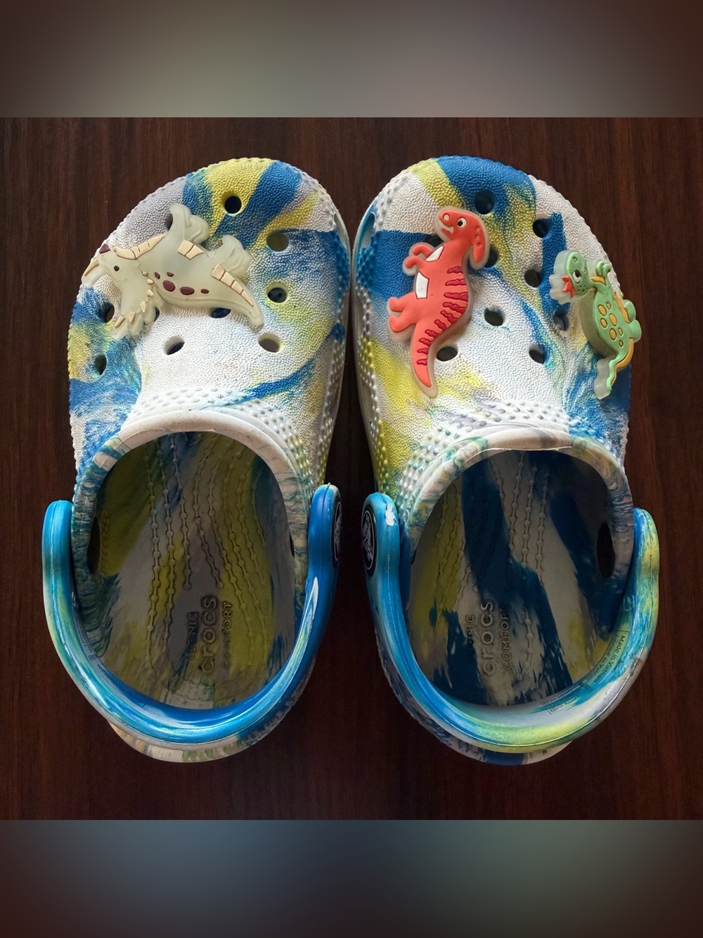 CROCS Size 6 Tie-Dye Clogs with Dino Charms